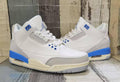 White & Grey Retro Sneakers with Blue Accents